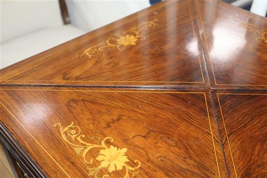 An Edwardian inlaid rosewood envelope card table W.55cm